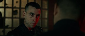 Movie still from “Centaur” (2022), directed by Daniel Calparsoro – A person looking at a mirror; Close Up shot, Over the shoulder angle