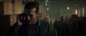 Movie still from “Centaur” (2022), directed by Daniel Calparsoro – A person wearing a jacket; Close Up shot, Over the shoulder angle