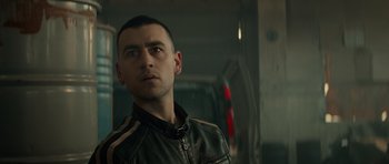 Movie still from “Centaur” (2022), directed by Daniel Calparsoro – A person wearing a leather jacket; Close Up shot, Low angle