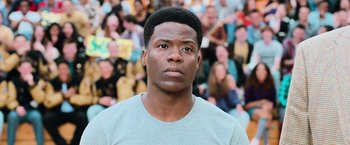 Movie still from “Central Intelligence” (2016), directed by Rawson Marshall Thurber – A person with a crowd in the background; Close Up shot, Over the shoulder angle