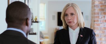 Movie still from “Central Intelligence” (2016), directed by Rawson Marshall Thurber – A person wearing a suit and tie; Close Up shot, Over the shoulder angle