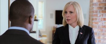Movie still from “Central Intelligence” (2016), directed by Rawson Marshall Thurber – A woman wearing a suit talking to a man; Close Up shot, Over the shoulder angle