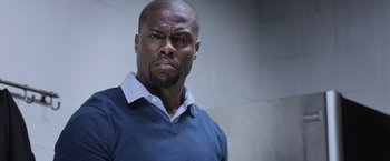 Movie still from “Central Intelligence” (2016), directed by Rawson Marshall Thurber – A person wearing a blue shirt; Close Up shot, Low angle