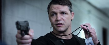 Movie still from “Central Intelligence” (2016), directed by Rawson Marshall Thurber – A person wearing a black shirt; Close Up shot, Low angle