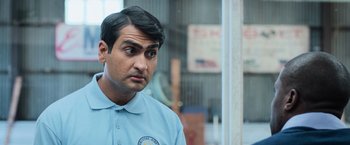 Movie still from “Central Intelligence” (2016), directed by Rawson Marshall Thurber – A person wearing a blue shirt; Close Up shot, Over the shoulder angle