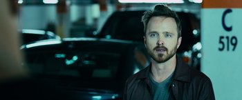 Movie still from “Central Intelligence” (2016), directed by Rawson Marshall Thurber – A person with a car in the background; Close Up shot, Over the shoulder angle