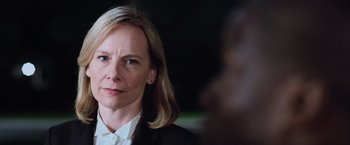 Movie still from “Central Intelligence” (2016), directed by Rawson Marshall Thurber – A person wearing a suit and tie; Close Up shot, Over the shoulder angle