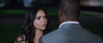 Movie still from “Central Intelligence” (2016), directed by Rawson Marshall Thurber – A woman looking at a man in a gray suit; Close Up shot, Over the shoulder angle