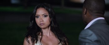 Movie still from “Central Intelligence” (2016), directed by Rawson Marshall Thurber – A woman with long black hair wearing a white dress; Close Up shot, Over the shoulder angle