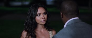 Movie still from “Central Intelligence” (2016), directed by Rawson Marshall Thurber – A beautiful woman with long black curly hair; Close Up shot, Over the shoulder angle