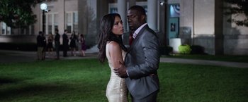 Movie still from “Central Intelligence” (2016), directed by Rawson Marshall Thurber – A man and a woman standing next to each other; Medium shot, Over the shoulder angle