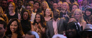 Movie still from “Central Intelligence” (2016), directed by Rawson Marshall Thurber – A group of people standing in front of each other clapping; Wide shot, High angle