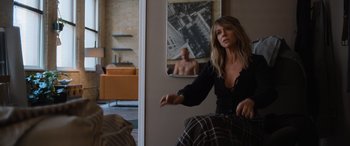 Movie still from “Champions” (2023), directed by Bobby Farrelly – A woman sitting in front of a mirror in a room; Medium shot, Over the shoulder angle
