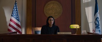 Movie still from “Champions” (2023), directed by Bobby Farrelly – A judge sitting in front of a judge's desk; Medium shot, Low angle