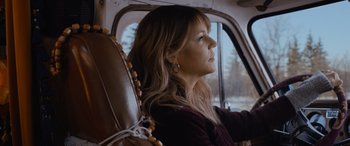 Movie still from “Champions” (2023), directed by Bobby Farrelly – A woman sitting in the passenger seat of a car; Close Up shot, Low angle