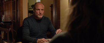 Movie still from “Champions” (2023), directed by Bobby Farrelly – A man sitting in front of a woman at a table; Close Up shot, Over the shoulder angle