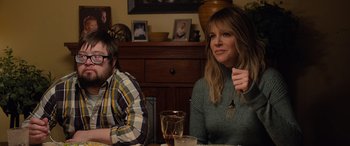 Movie still from “Champions” (2023), directed by Bobby Farrelly – A woman sitting at a table in front of a man; Medium shot, Over the shoulder angle