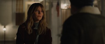 Movie still from “Champions” (2023), directed by Bobby Farrelly – A woman standing in front of a man in front of a building; Close Up shot, Over the shoulder angle