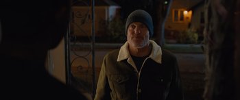 Movie still from “Champions” (2023), directed by Bobby Farrelly – A man wearing a jacket and a hat; Medium shot, Over the shoulder angle
