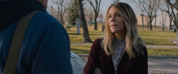 Movie still from “Champions” (2023), directed by Bobby Farrelly – A woman in a red jacket is looking at a man; Close Up shot, Over the shoulder angle