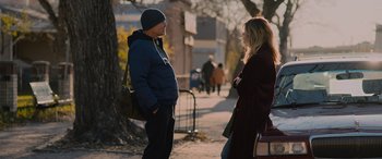 Movie still from “Champions” (2023), directed by Bobby Farrelly – A man and a woman talking on the sidewalk; Medium shot, Over the shoulder angle