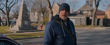 Movie still from “Champions” (2023), directed by Bobby Farrelly – A man wearing a blue jacket and a blue hat; Medium shot, Over the shoulder angle