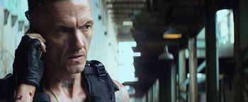 Movie still from “Chappie” (2015), directed by Neill Blomkamp – A person with a backpack; Close Up shot, Low angle