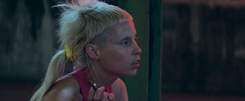 Movie still from “Chappie” (2015), directed by Neill Blomkamp – A woman with blonde hair is looking to her left; Close Up shot, Over the shoulder angle