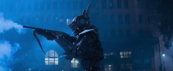 Movie still from “Chappie” (2015), directed by Neill Blomkamp – A robot is standing in the middle of the night; Medium shot, Low angle