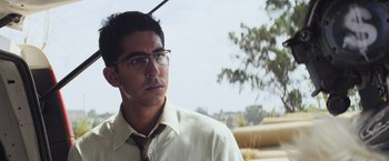 Movie still from “Chappie” (2015), directed by Neill Blomkamp – A man wearing glasses and a white shirt; Close Up shot, Low angle