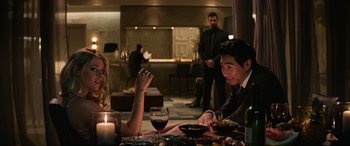 Movie still from “Charlie's Angels” (2019), directed by Elizabeth Banks – A man and a woman sitting at a dinner table; Medium shot, Over the shoulder angle