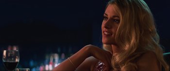 Movie still from “Charlie's Angels” (2019), directed by Elizabeth Banks – A beautiful blonde woman with a smile on her face; Close Up shot, Over the shoulder angle