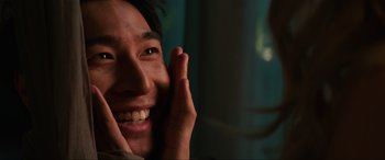 Movie still from “Charlie's Angels” (2019), directed by Elizabeth Banks – A person talking on a cell phone; Extreme Close Up shot, Over the shoulder angle