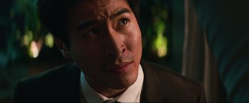 Movie still from “Charlie's Angels” (2019), directed by Elizabeth Banks – A person wearing a suit and tie; Close Up shot, Low angle