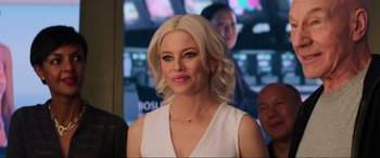 Movie still from “Charlie's Angels” (2019), directed by Elizabeth Banks – A woman with blonde hair wearing a white dress; Close Up shot, Over the shoulder angle
