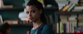 Movie still from “Charlie's Angels” (2019), directed by Elizabeth Banks – A beautiful young woman with long dark hair; Close Up shot, Over the shoulder angle