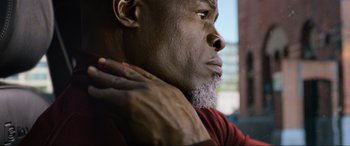 Movie still from “Charlie's Angels” (2019), directed by Elizabeth Banks – A person with a gray beard; Close Up shot, Low angle