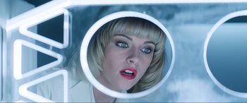 Movie still from “Charlie's Angels” (2019), directed by Elizabeth Banks – A woman looking into a mirror with red lipstick; Close Up shot, Overhead angle