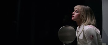 Movie still from “Charlie's Angels” (2019), directed by Elizabeth Banks – A woman standing in front of a round mirror; Close Up shot, Low angle