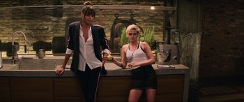 Movie still from “Charlie's Angels” (2019), directed by Elizabeth Banks – Two beautiful young women standing next to each other; Medium shot, High angle