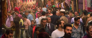 Movie still from “Charlie's Angels” (2019), directed by Elizabeth Banks – A crowd of people walking down a street; Extreme Wide shot, High angle