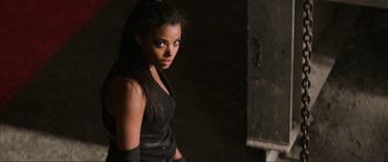 Movie still from “Charlie's Angels” (2019), directed by Elizabeth Banks – A beautiful young woman wearing a black top; Medium shot, Low angle