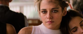 Movie still from “Charlie's Angels” (2019), directed by Elizabeth Banks – A person wearing a white shirt; Extreme Close Up shot, Overhead angle