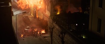 Movie still from “Charlie's Angels” (2019), directed by Elizabeth Banks – A building on fire in the middle of the night; Extreme Wide shot, High angle