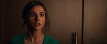 Movie still from “Charlie's Angels” (2019), directed by Elizabeth Banks – A person wearing a green shirt; Close Up shot, Over the shoulder angle