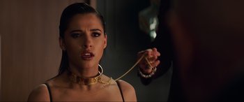 Movie still from “Charlie's Angels” (2019), directed by Elizabeth Banks – A woman in chains is chained to the neck of another woman; Close Up shot, Over the shoulder angle