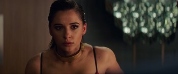 Movie still from “Charlie's Angels” (2019), directed by Elizabeth Banks – A person wearing a necklace; Close Up shot, Over the shoulder angle