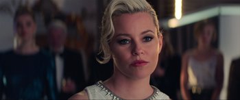 Movie still from “Charlie's Angels” (2019), directed by Elizabeth Banks – A person with blonde hair; Close Up shot, Over the shoulder angle