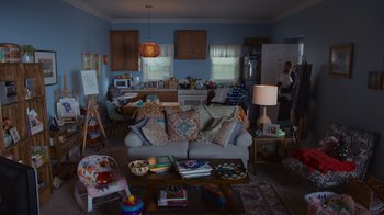 Movie still from “Cheaper by the Dozen” (2022), directed by Gail Lerner – A living room filled with lots of furniture and decor; Wide shot, High angle