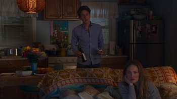 Movie still from “Cheaper by the Dozen” (2022), directed by Gail Lerner – A man and a woman in a kitchen; Medium shot, Over the shoulder angle